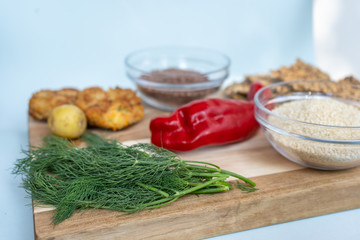 sesame and flax seed, red pepper healthy bread bread and dill on the wooden backround