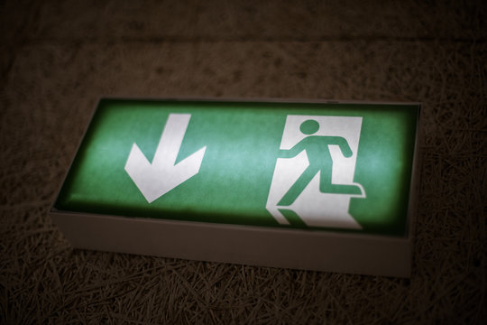 Green exit sign above a door