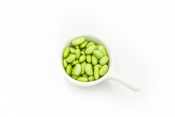 green peas in a bowl isolated on white background