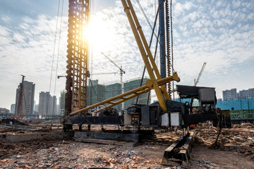 Spiral pile driver on construction site