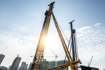 Spiral pile driver on construction site