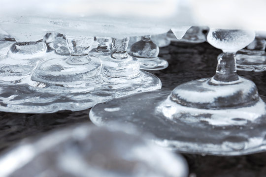 Close up view of frozen water as it spills from Lake Hirose in Japan