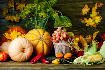 The table, decorated with vegetables and fruits. Harvest Festival. Happy Thanksgiving. Autumn background. Selective focus.