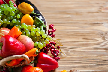 The table, decorated with vegetables and fruits. Harvest Festival. Happy Thanksgiving. Autumn background. Selective focus.