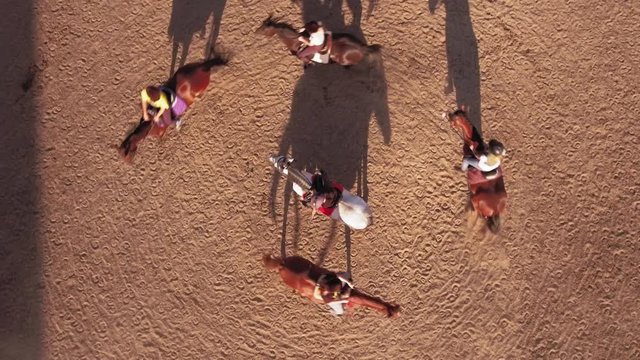 Aerial photography. Riders ride horses. Hippodrome.