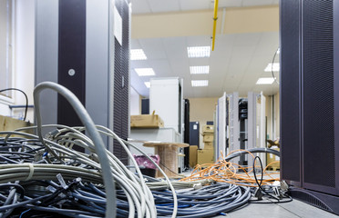 cable installation in the server room. Installation of equipment in a modern data center, a lot of...