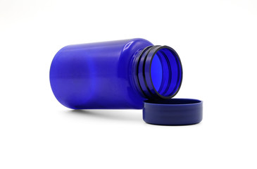 Opened blue plastic medicine bottle isolated on white background.