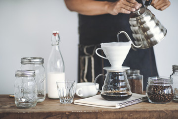 Drip coffee on a wooden bar White background