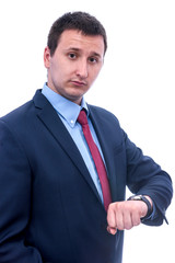 Portrait of businessman looking at watch isolated on white