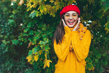 Autumn woman in autumn park. Warm sunny weather. Fall concept