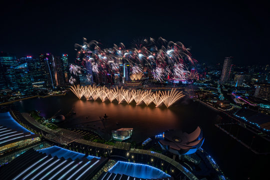 Singapore skyscrapers and fireworks at night