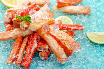 crab meat and body pacrab meat and body parts, tentacles, knee cubes, blue marine background on...