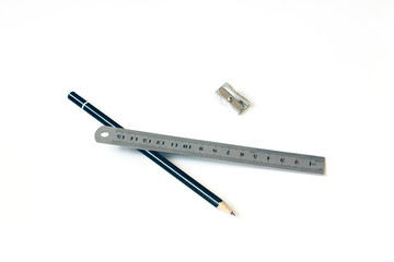 Pencil and ruler with a pen on a white background. Draw. Paint. Close-up. Copy space