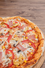 Pepperoni Pizza with Mozzarella cheese, Ham, Tomatoes, pepper, Spices . Italian pizza.