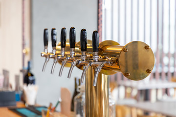 brass and stainless beer dispenser.