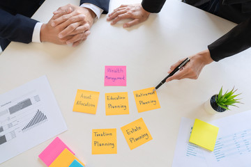 wealth management concept, business man and team analyzing financial statement for planning...