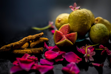 Guava, Neem or Indian lilac leaves, turmeric powder well mixed in a glass bowl for treatment of...