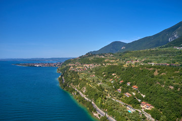 Obraz premium Aerial photography with drone. Steep Cliffs By the Water, Lake Garda, Italy.