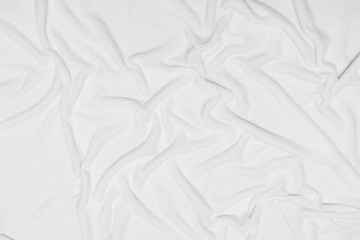 White crumpled blanket, texture, top view