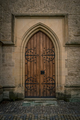 Arched medieval gothic door in Kutna Hora, Czech Republic
