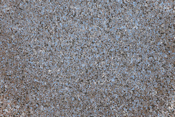 The background of polished granite in blue black shades. A background for design and creative work. Decoration and exterior decoration of the building. Construction works