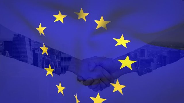 EU flag with businessmen shaking hands in the background