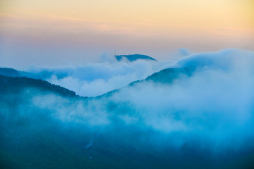Fototapeta na wymiar aerial view of foggy mountains