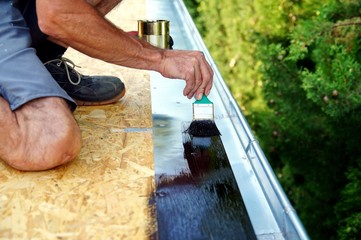 preparation for installing tar foil on the rooftop of building. Roofer cover the rooftop polymer...