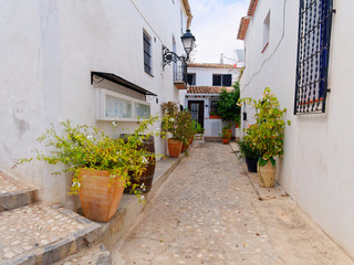 A beautiful street with beautiful white houses in Altea. Costa Blanca. Spain.