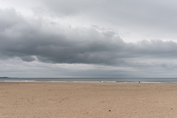Fototapeta na wymiar beach with grey sky and sea background hartlepool