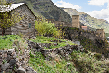 Fototapeta na wymiar Khertvisi fortress and residential wooden house. Samtskhe-Javakheti region, southern Georgia