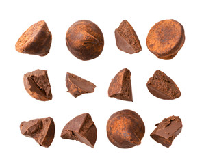 Set of truffle candies broken into pieces on a white, isolated.