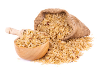 pounded unripe rice in jute on white background