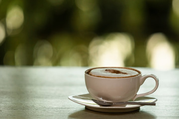 cappuccino coffee on the old wooden table
