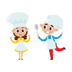 Chefs kids in uniform in restaurant kitchen cooking.