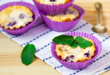 sweet cheese blueberry muffins on a wooden background