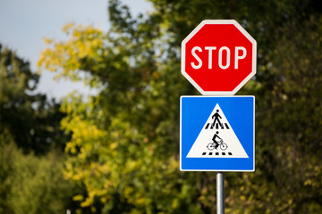 Stop sign, pedestrian and bicycle crosswalk sign