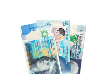 three different 5 Pounds Sterling banknotes issued by Scottish Banks with copyspace