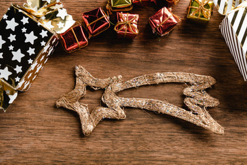 Pine cones and Christmas shooting star on wood background. Christmas decoration