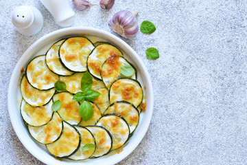 Baked zucchini with parmesan sauce and cheese. Summer zucchini pie.Zucchini casserole.