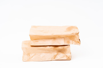 Crumpled brown paper bag on white background