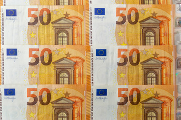 Banknotes 50 euros beautifully laid out. Euro notes background on a long banner. Beautiful original cash flow