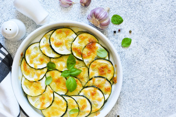 Baked zucchini with parmesan sauce and cheese. Summer zucchini pie.Zucchini casserole.