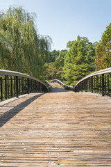 Fototapeta na wymiar Raleigh/ NC/ USA - August 7, 2019: bridge at the Pullen Park, the oldes in town, established in 1887