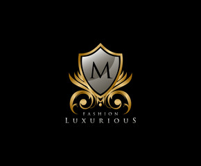 Luxury Golden Shield Logo with M Letter,  royal shield logo icon.
