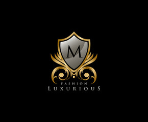 Luxury Golden Shield Logo with M Letter,  royal shield logo icon.