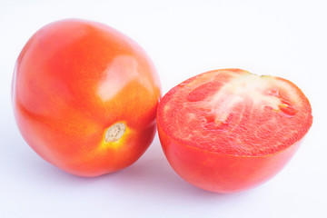 Sliced tomatoes isolated on white background. Background of organic food.