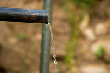 Flowing Water from a tap highlighting the concept to save the water 