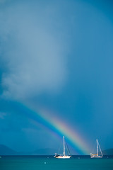 Rainbow landing behind a sailboat, St. John, USVI.