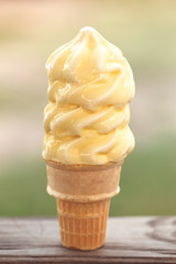 A Vanilla Soft Serve Ice Cream Cone Melting in the Summer Heat